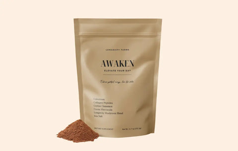 NAD drink powder from Awaken pouch spilled beside product bag labeled Elevate Your Day.
