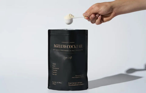 Supplements for a better mood being scooped from a black pouch