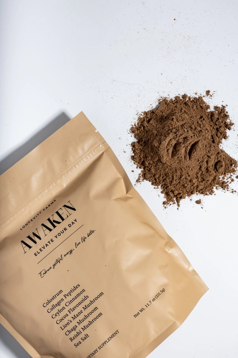 Collagen powder supplement Awaken by Longevity Farms, featuring colostrum, Ceylon cinnamon, cocoa flavonoids, lion’s mane, chaga, and reishi mushrooms with sea salt for wellness support.